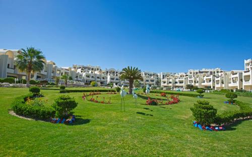 a large park in front of a large building at Buki-Gravity-Homes, App No1, amazing spacy beachfront apartment in 5 star hotel Gravity Sahl Hasheesh in Hurghada