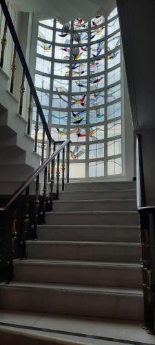 a staircase in a building with a stained glass ceiling at BOSPHORUS in Sarıyer
