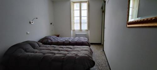 מיטה או מיטות בחדר ב-affittacamere Monte inni
