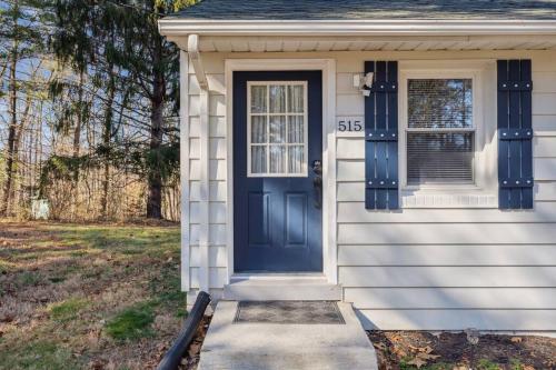 a house with a blue door and a window at Valley Vista-Mins to SkylineDrive-Hot Tub-King, Queen Beds in Front Royal