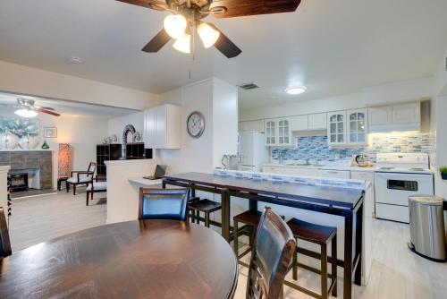 a kitchen and dining room with a table and chairs at Near Airport and Dtwn Breezy Fresno Home! in Fresno