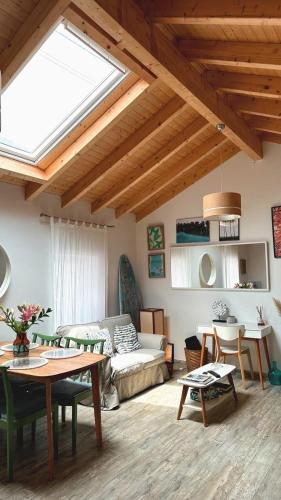 a living room with a skylight in the ceiling at A Casa da Mariana in Casa Nova