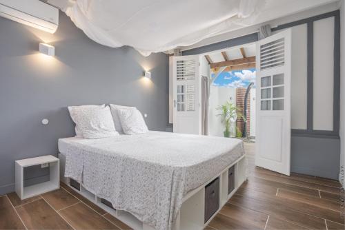 Postel nebo postele na pokoji v ubytování Bungalow Ti Coco