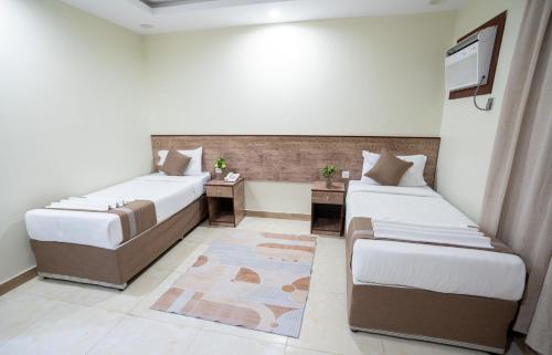 فندق سما سول للشقق tesisinde bir odada yatak veya yataklar