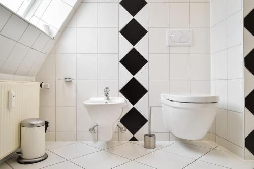 a bathroom with a toilet and a sink at Secret escape above Stuttgart in Stuttgart