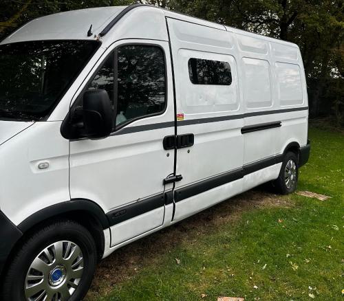 a white van parked in a field of grass at VAN CONVERSION FOR ACCOMODATION in Waldingfield