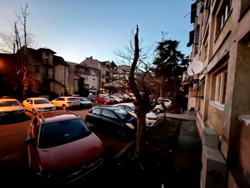 a group of cars parked on a city street at Aleks 4 in Skopje