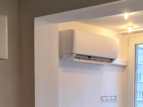 a kitchen with a microwave hanging from a wall at Vicky - New Apartment Centrum Srodmiescie in Warsaw