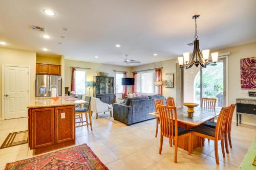 a kitchen and living room with a table and chairs at Green Valley Townhome with Community Amenities! in Green Valley