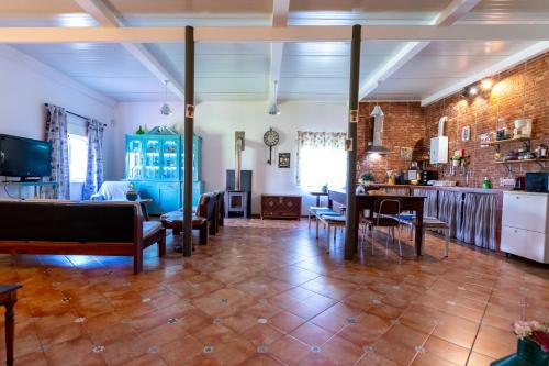 a living room with a couch and a table at Natur - Quinta Nª Srª da Conceição - T4 - Golegã in Golegã