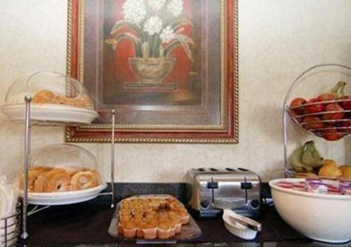 a kitchen counter with plates of food and a toaster at Sleep Inn Pelham Oak Mountain in Pelham