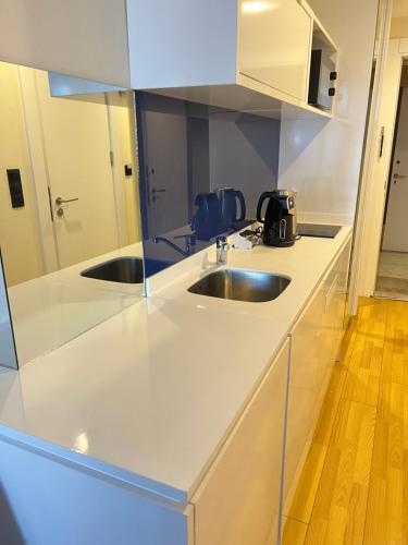 a kitchen with a sink and a counter top at Sea views apartments In Batumi in Batumi