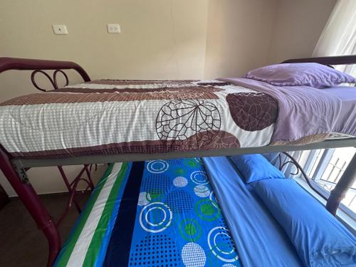 Posteľ alebo postele v izbe v ubytovaní Baños de Agua Santa