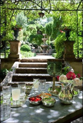 a table with glasses and plates of food on it at Herdade de Santa Maria in Almeirim