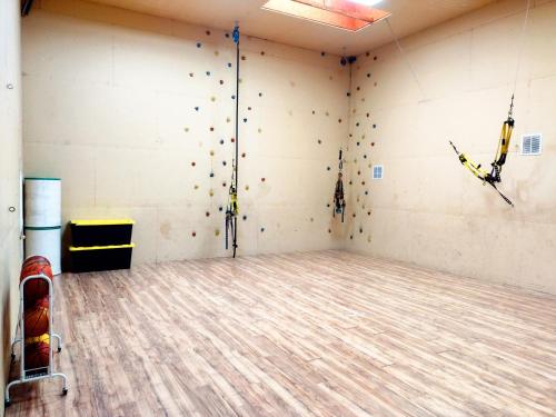 an empty room with a rock climbing wall at 4B Miracle Lodge - Stay&Play Together-Events/Reunions/Staycation/Ski in South Jordan