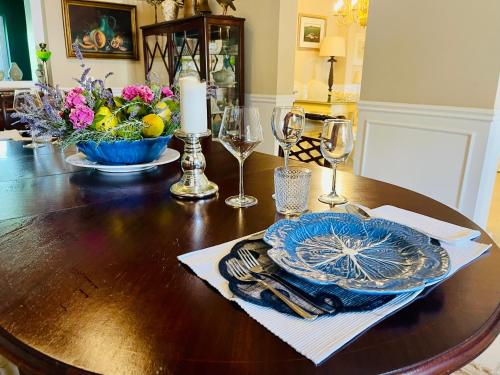 a table with a blue plate and a candle on it at Herdade de Santa Maria in Almeirim