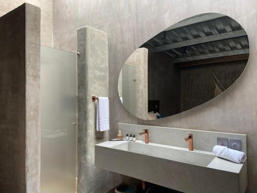 a bathroom with a sink and a mirror at Lovely 2BR Villa with Ocean View in Cartagena in Cartagena de Indias