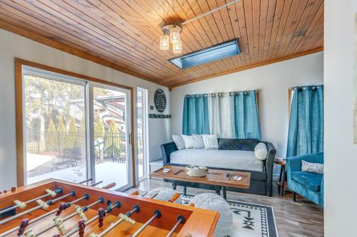 a living room with a bed and a table at Cozy Tiffin House with Private Pool 1 Mi to Town! in Tiffin