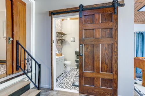 a door leading to a bathroom with a toilet at Cozy Tiffin House with Private Pool 1 Mi to Town! in Tiffin