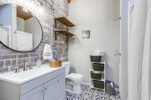 a bathroom with a white sink and a mirror at Cozy Tiffin House with Private Pool 1 Mi to Town! in Tiffin