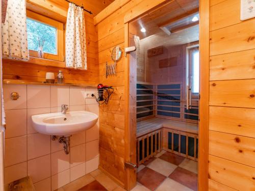 a bathroom with a sink and a shower at Chalet Emely in Piesendorf