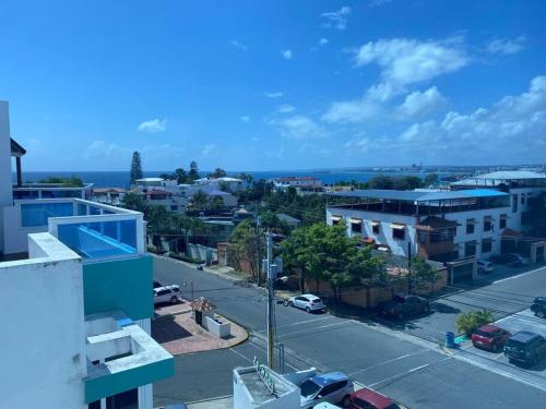 a view of a city from a building at Modesto y Acogedor Apartamento en Costa Verde in Santo Domingo