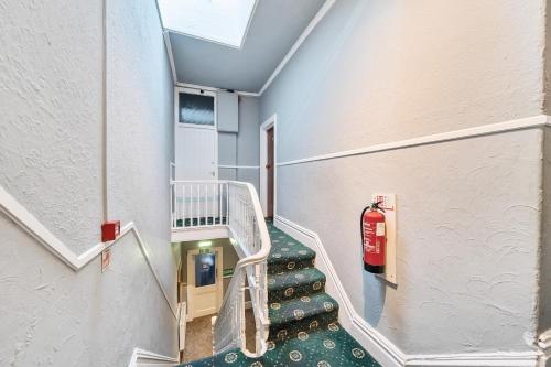 a staircase in a building with a fire hydrant at Willin House Hotel in Blackpool
