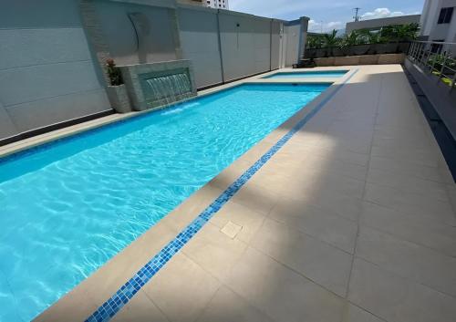 an empty swimming pool on top of a building at Apartamentos Amoblados Confort Turismo en Cúcuta in Cúcuta