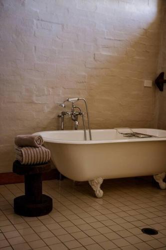 a white bath tub in a bathroom with at The Old Clarence Brewery in Maclean