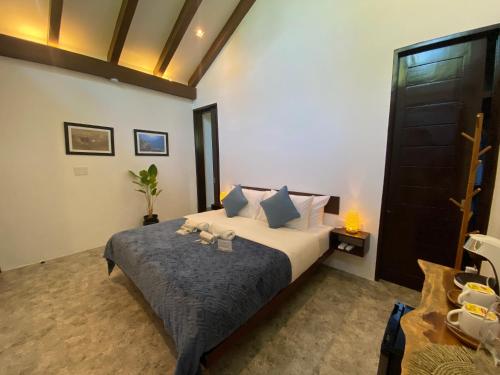 a bedroom with a bed in a room at Amila Dive Beach Resort in Sipalay