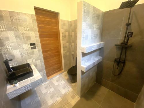 a bathroom with a shower and a toilet and a sink at S&S House 2 in Koh Phangan