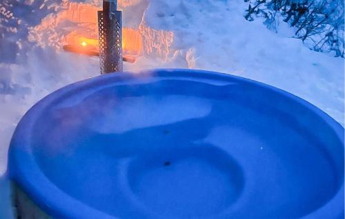 a blue toilet in the snow with a street at Amazing Home In Dalen With Wifi in Dalen