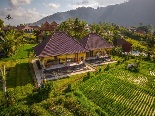 an aerial view of a villa in a garden at The babakan accommodations in Sidemen