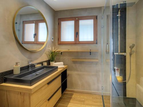 a bathroom with a sink and a mirror at Chalet La Clusaz, 4 pièces, 6 personnes - FR-1-304-287 in La Clusaz