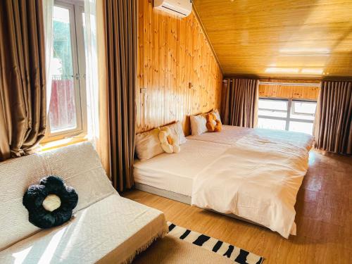 En eller flere senge i et værelse på Villa Đường Mây 2