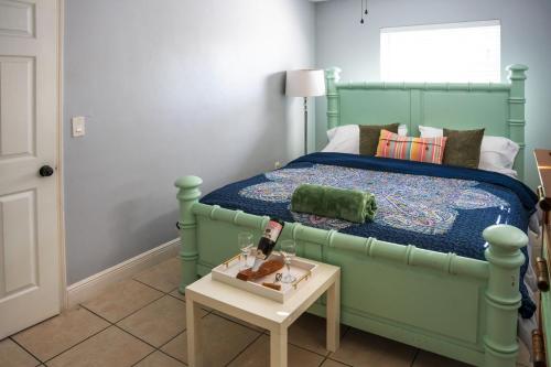 a bedroom with a bed and a table with a doll on it at 5 Mins from Clearwater Beach with Free Wi-Fi & TV in Clearwater