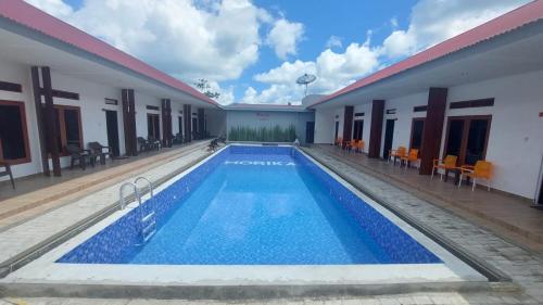 a view of a swimming pool in a hotel at Morika Inn in Waikabubak