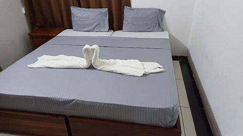Кровать или кровати в номере The Palm Residence