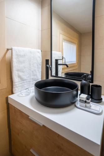 a bathroom with a black sink on a counter at B&B Villa Rosa in Padova