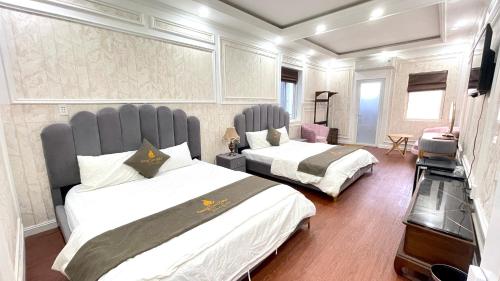 Ένα ή περισσότερα κρεβάτια σε δωμάτιο στο BÔNG SEN HOTEL CÔN ĐẢO