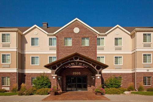 a large brick building with an entry way at Staybridge Suites Sioux Falls at Empire Mall by IHG in Sioux Falls