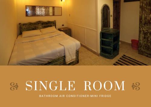 Postel nebo postele na pokoji v ubytování Mirage Village