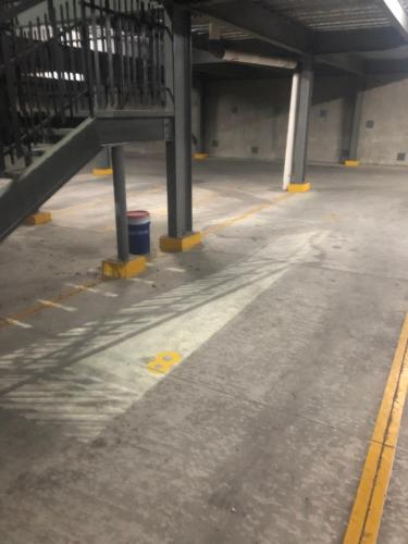 an empty parking lot in a parking garage at Cozy PH Apartment in the City in Guatemala