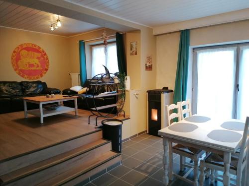 a living room with a couch and a table at Ca’Benvenuto in Doische