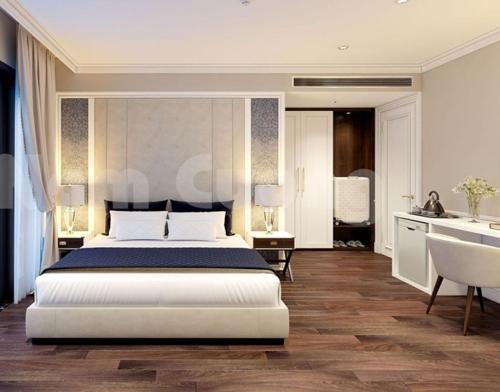 1 dormitorio con 1 cama blanca grande y cocina en Vang Vieng Romantic Mountain View Resort en Vang Vieng