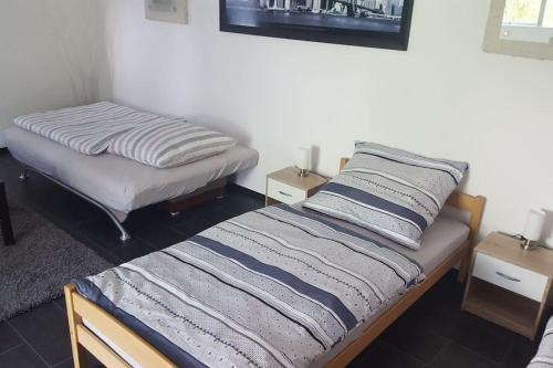 Ένα ή περισσότερα κρεβάτια σε δωμάτιο στο Guest RooM