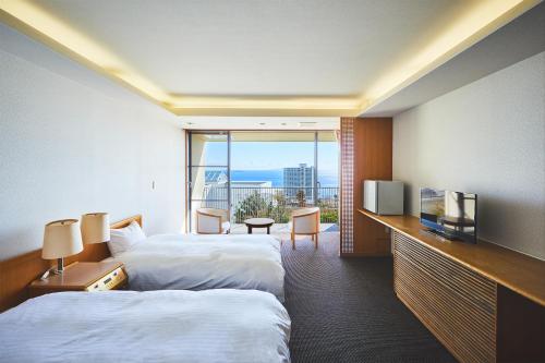 Postel nebo postele na pokoji v ubytování Shiki Resort Atami Boyokan