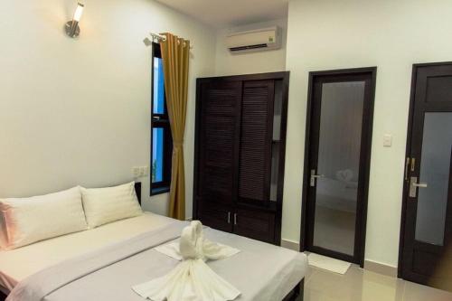 Katil atau katil-katil dalam bilik di Vạn Nguyên Minihouse Mũi Né Resort - by Bay Luxury