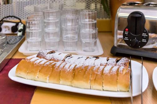 a banana on a plate on a table with glasses at HOTEL RAJSKY in Český Krumlov