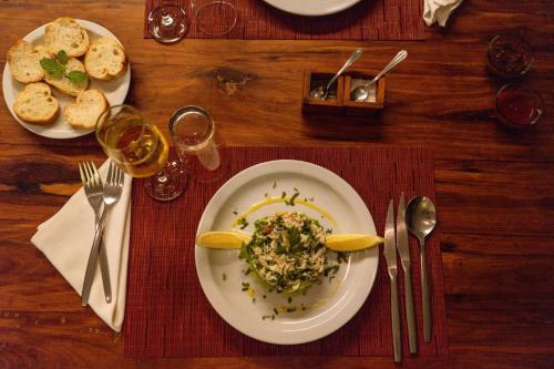 a table with a plate of food on a table at Duna Sonambula in Praia do Tofo